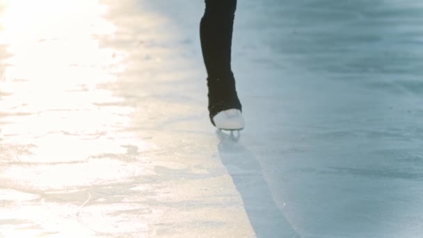 Ice skating in early morning - young woman figure skating — Stock Video