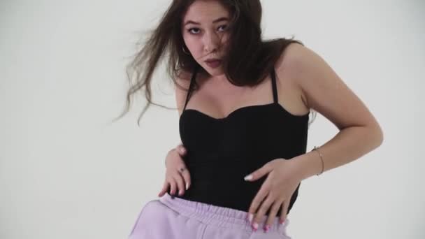 Dancing - young asian stylish woman with long hair sexy dancing on cyclorama - dancing with her hips — Stock Video