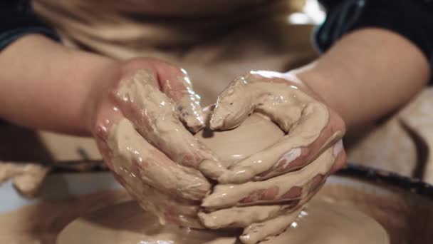 Pottery crafting - womans hands forms clay in some kind of shape — Stock Video