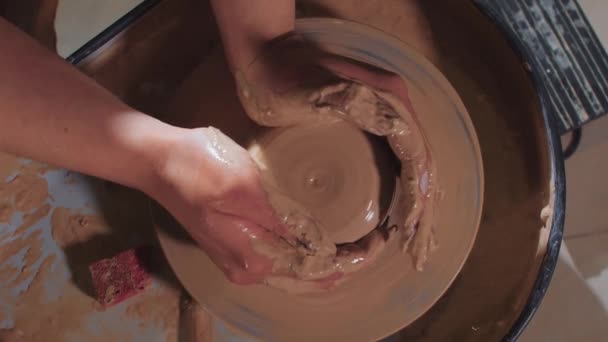 Pottery crafting - forming a wet clay in longer and narrow shape — Stock Video