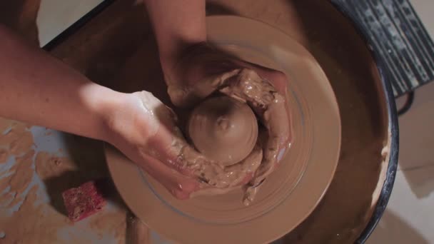 Pottery crafting - forming a wet clay in shape of long cylinder — Stock Video