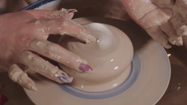 Pottery crafting - makes a slight recess in the wet clay and keeps the shape of the object strictly — Stock Video