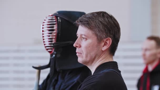 RUSSIA, KAZAN 24-04-2021: Kendo tournament - japanese martial art - man fighter and his trainer standing in the gym — Stock Video