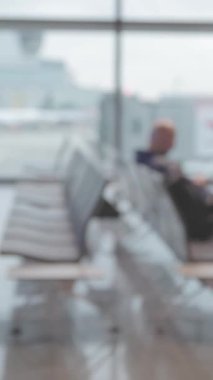 White airport lounge from the moving perspective - blurred footage. Mid shot