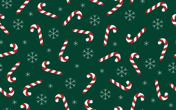 Şeker kamışları ve kar taneleri pürüzsüz desen. Kar ve şekerlemelerle dolu yeşil arka plan. Tatil tasarımı.