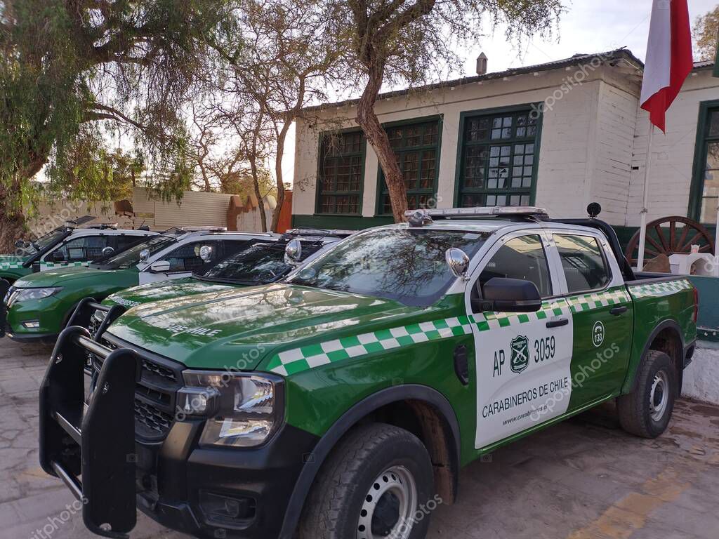 San Pedro de Atacama, El Loa, Antofagasta, Chile - June 04, 2025: Green white Ford Ranger pick-up truck police patrol car of Carabineros de Chile parked at local police station.