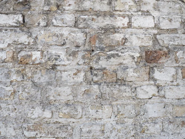 Antigua pared de ladrillo rústico dañado con fondo de textura de yeso — Foto de Stock