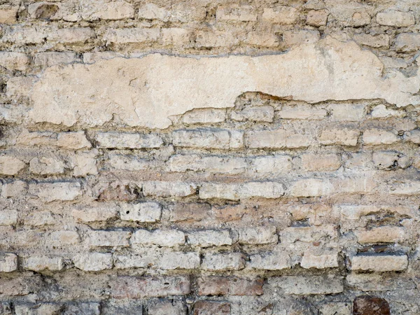 Antigua pared de ladrillo rústico dañado con fondo de textura de yeso — Foto de Stock