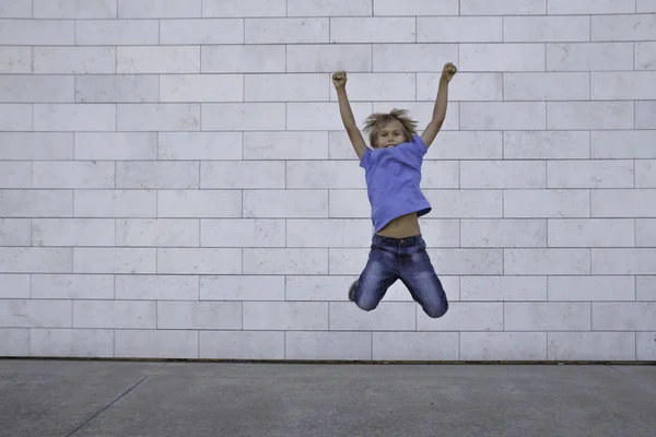Happy little boy jumps high. People, childhood, happiness, freedom, movement concept