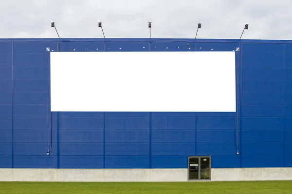 Mock up. Empty horizontal billboard screen on the blue wall.