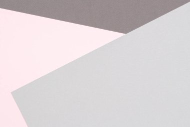 Soyut renkli kağıt dokusu arkaplanı. Pastel pembe ve açık gri renkte minimal geometrik şekiller ve çizgiler