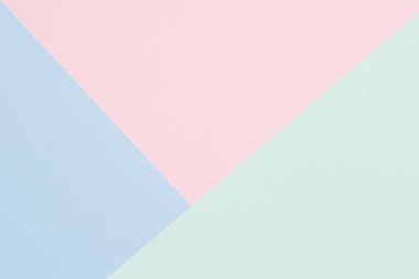 Soyut renkli kağıt dokusu arkaplanı. Açık mavi, pastel pembe ve yeşil renkte en az geometrik şekil ve çizgiler