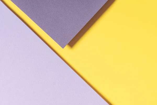 Fondo de papel geométrico abstracto en colores amarillo y gris. Iluminante de moda amarillo y último fondo de colores grises — Foto de Stock