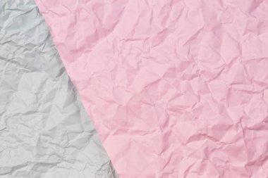 Pastel pembe ve açık gri buruşuk kağıt doku arkaplanı