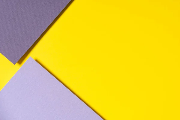 Abstrakt geometriskt papper bakgrund i gul, ljus och mörkgrå färger — Stockfoto