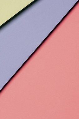 Soyut renkli kağıt dokusu arkaplanı. Açık mavi, pastel pembe ve yeşil renkte en az geometrik şekil ve çizgiler