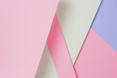 Soyut renkli kağıt dokusu arkaplanı. Açık mavi, pastel pembe ve yeşil renkte en az geometrik şekil ve çizgiler