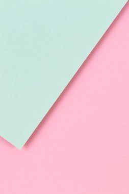 Soyut renkli kağıt dokusu arkaplanı. Pastel pembe ve açık yeşil renklerde minimum geometrik şekiller ve çizgiler