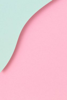 Soyut renkli kağıt dokusu arkaplanı. Pastel pembe ve açık yeşil renklerde minimum geometrik şekiller ve çizgiler