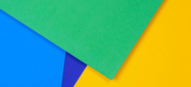 Yaratıcı soyut mavi, yeşil ve sarı renkli geometrik kağıt kompoziton arkaplan, üst görünüm