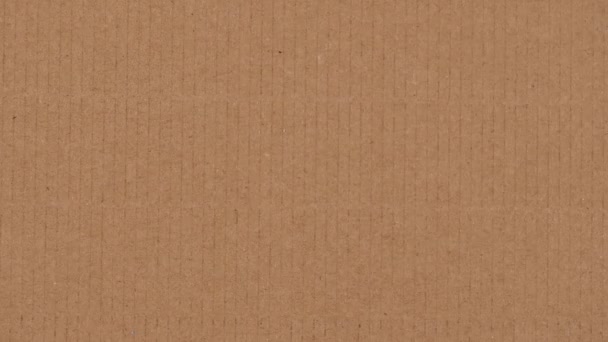 Cartoncino ondulato marrone sfondo texture carta. Vista dall'alto. Animazione stop motion, video 4k — Video Stock