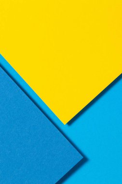 Soyut renk kağıtları geometri düz kompozisyon arkaplan sarı ve mavi tonlu