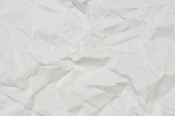 Licht grijs verfrommeld inpakpapier textuur achtergrond, bovenaanzicht — Stockfoto