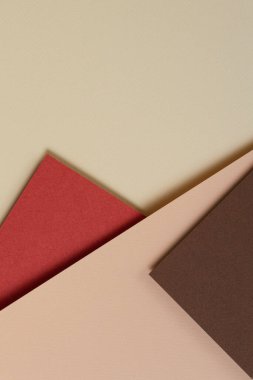 Toprak tonlarında soyut geometrik kağıt arka plan. Bej, sarı, mercan, kahverengi arkaplan