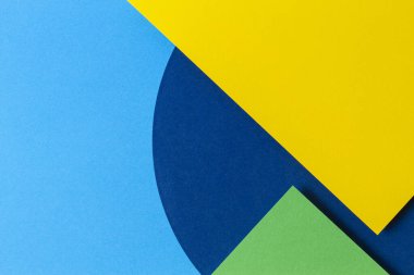 Soyut renkli kağıt dokusu arkaplanı. Açık mavi, lacivert, yeşil ve sarı renkli minimal geometrik şekiller ve çizgiler