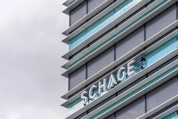 Vilnius, Lithuania - May 30, 2021: Schage real estate company logo on office wall. Schage Real Estate UAB is active in Lithuanian real estate market since 1998 — Stock Photo, Image