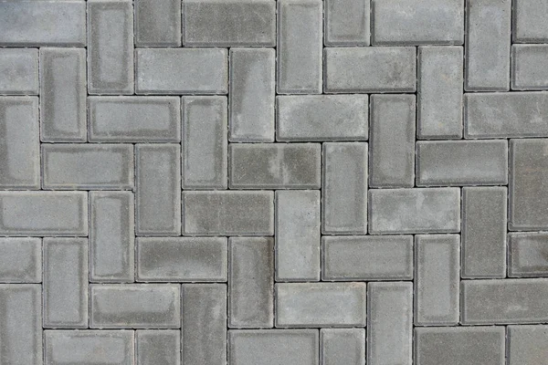 Фон тротуарной плитки серого цвета. Камни из серого кирпича на тротуаре города. Вид сверху — стоковое фото