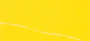 Yırtık grunge sarı kağıt arka plan yırtılmış. Tek renkli yırtık kağıt kolajı duvar kağıdı