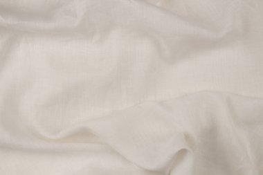 Yumuşak kumaşlı beyaz keten kumaş. Doğal lif ürünleri, sürdürülebilir moda..
