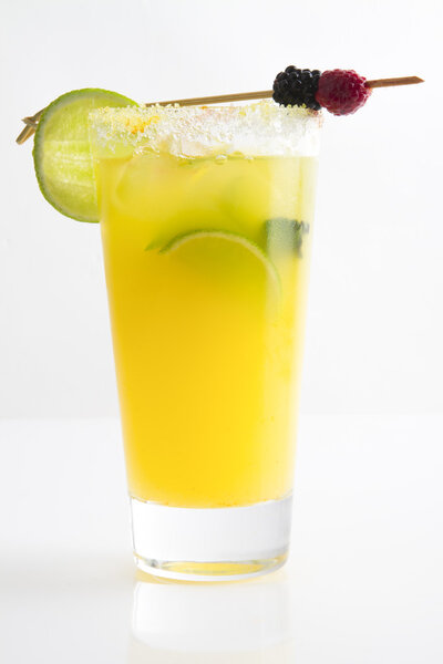yellow cocktail on white background