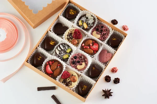 handmade chocolates, fruit and nuts, heart-shaped milk and dark chocolate