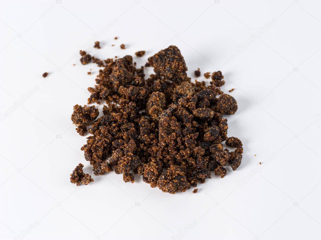brown granulated sugar on white background
