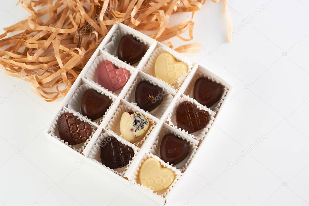 handmade chocolates, fruit and nuts, heart-shaped milk and dark chocolate