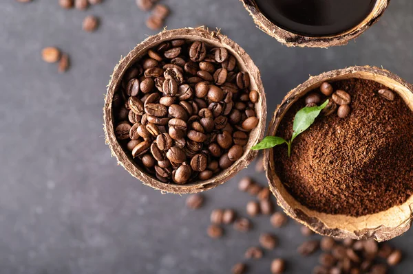 stages of preparation of black coffee, beans, ground, freshly brewed in coconut bowls