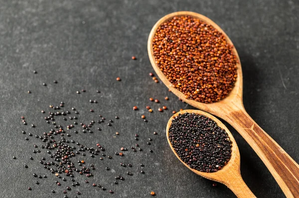 Superfood Quinoa Seeds Red Black Gray Background Wooden Spoons Close — Stock Photo, Image