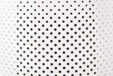 Beyaz delikli plastik dokusu, yakın plan.