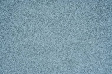 Mavi cephe alçı dokusu, ince bir yapı.