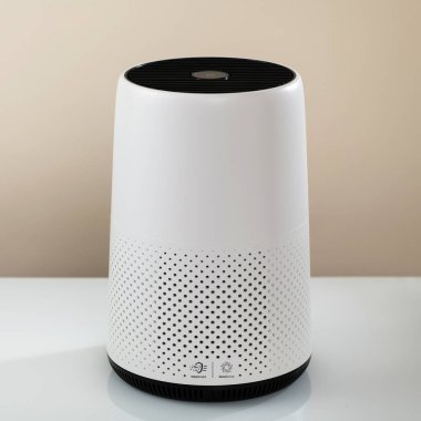 Air purifier, filters invisible viruses, allergens or pollutants in the house on a light background