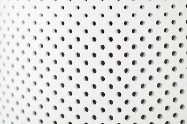 Beyaz delikli plastik dokusu, yakın plan.