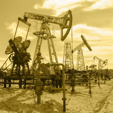 Pump jack and wellhead in the oilfield. clipart