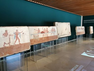 Paestum, Salerno, Campania, Italy - July 1, 2018: Tomb slabs exposed at the National Archaeological Museum clipart