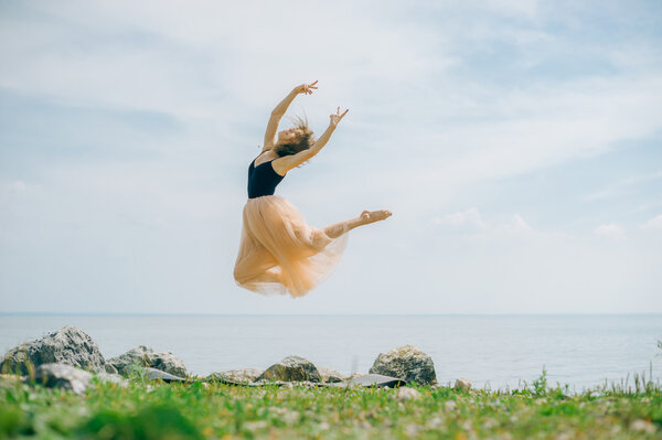 girl jumping against the sky. ballet items