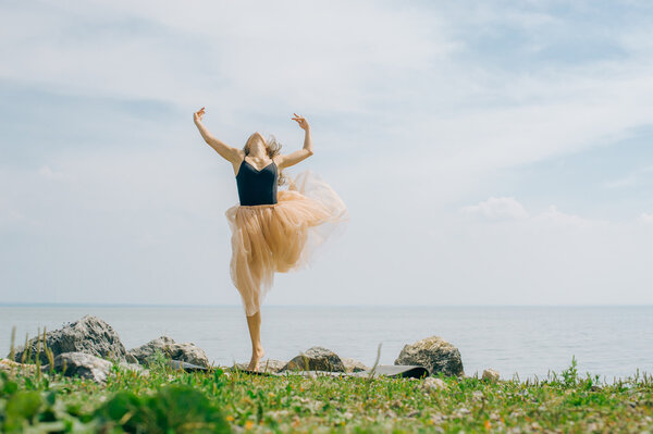 girl jumping against the sky. ballet items