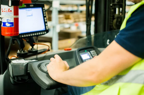 Driver Reachtruck busy working on the logistics warehouse store — Stock Photo, Image