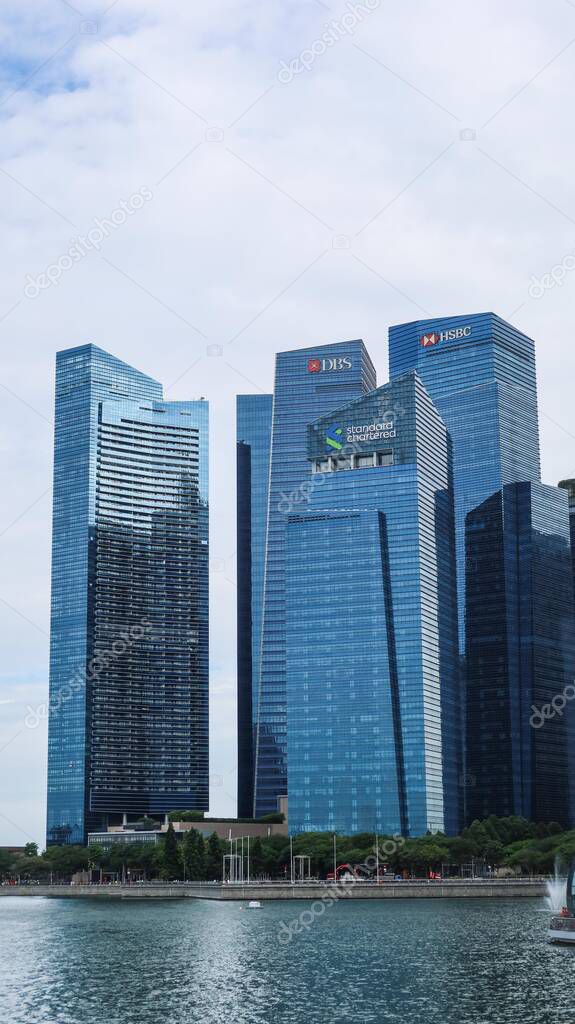 Marina Bay Financial Centre, Singapore- 13 Aug 2025: banks high rise skyscrapers with HSBC, Standard Chartered and DBS logo on the facade