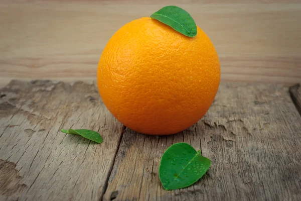 Orange, orange, orange on the wooden table in the background. — Stock Photo, Image